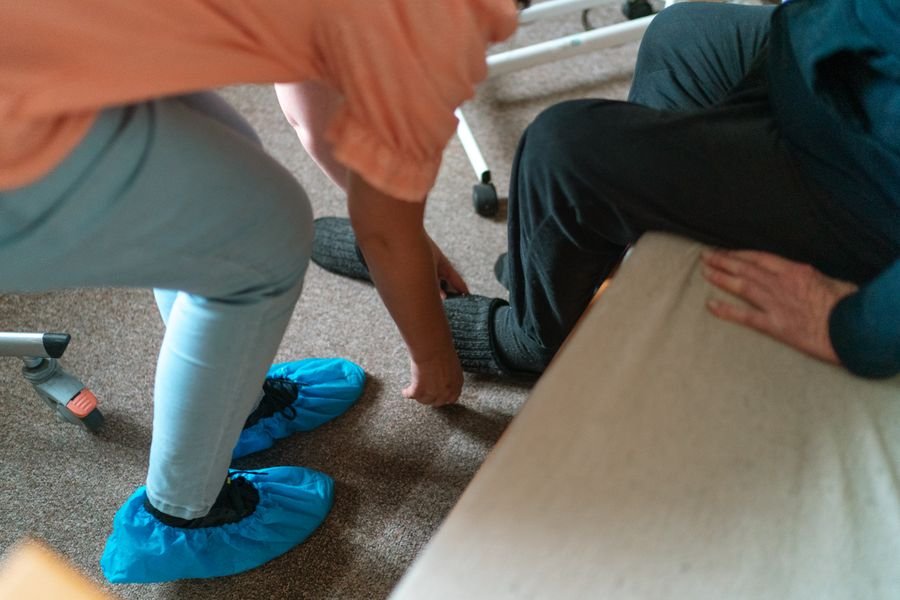 Caregiver helping with daily living tasks