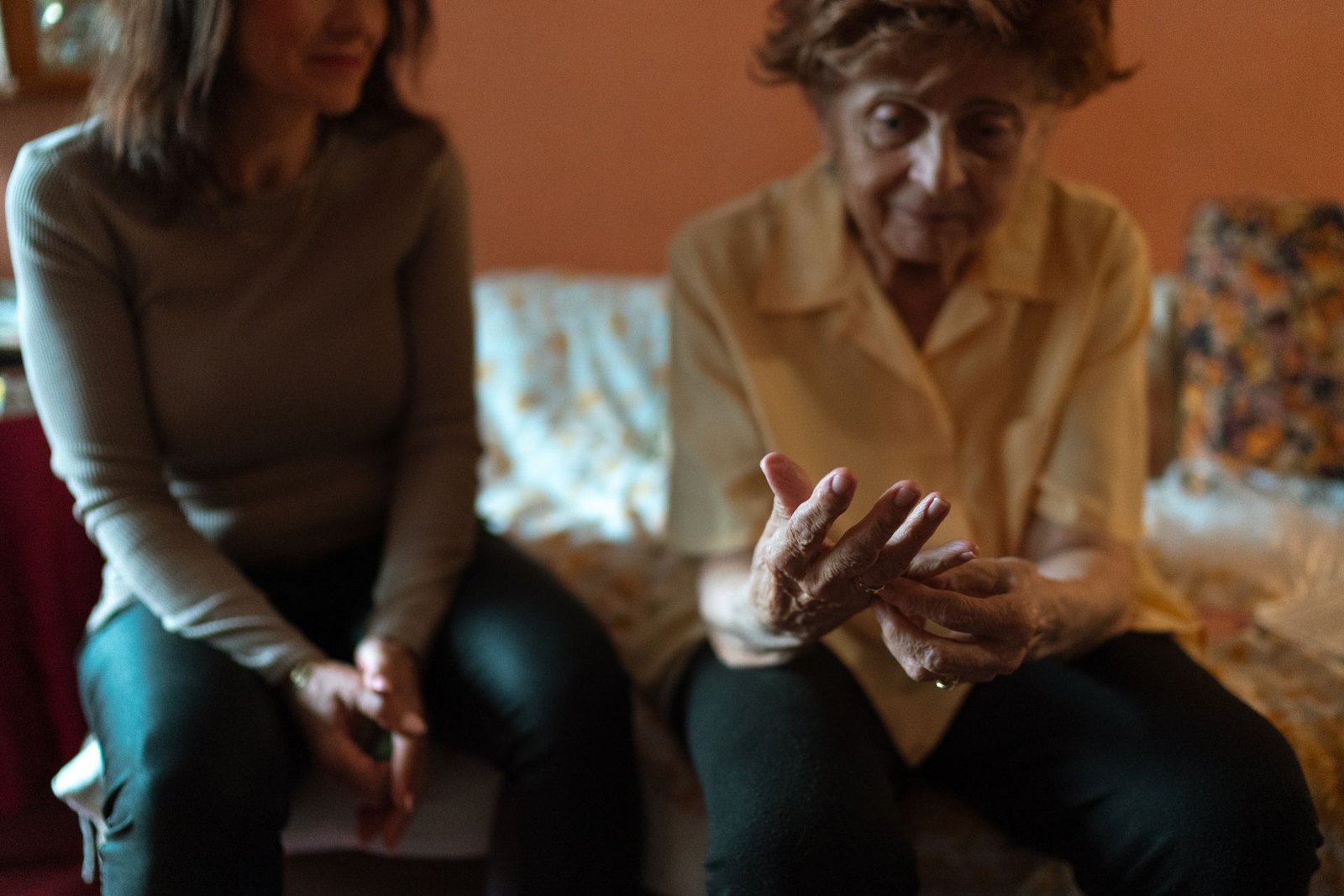Caregiver sharing a warm moment with a client at home